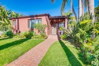 a brick house with a brick walkway at 4 Mi to Beach Chic Los Angles Home with Patio! in Los Angeles