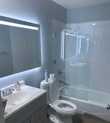 a bathroom with a shower and a toilet and a sink at Stunning Mediterranean Mansion in Laurel Canyon in Los Angeles