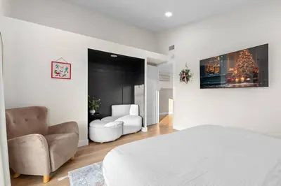 a bedroom with a bed and a couch and a chair at Modern Anaheim Stay- Minutes to Disney& Family Fun in Anaheim
