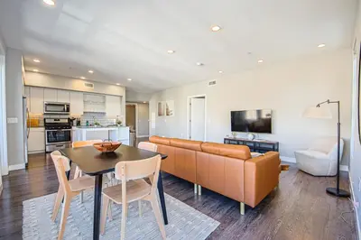 a living room with a couch and a table at Hollywood Escape! Elegant 2BR 2BA Rental in Los Angeles