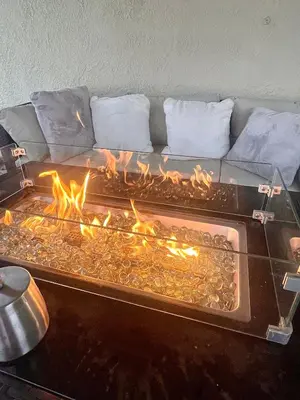 a fire pit with a couch in front of it at Sofi LAX Clippers Stay in Inglewood