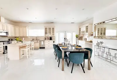 a kitchen with a dining room table and chairs at Luxury Oasis in Central Encino w Pool & Spa Topeka in Los Angeles