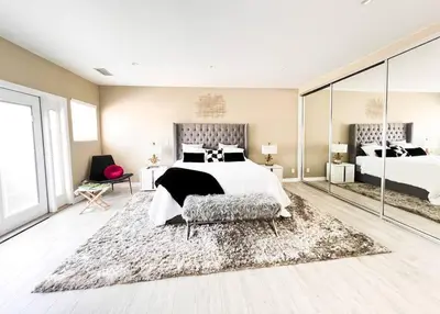 a large bedroom with a bed and a rug at Luxury Oasis in Central Encino w Pool & Spa Topeka in Los Angeles