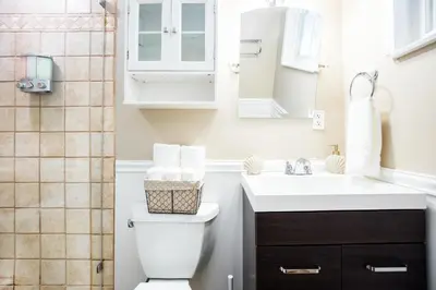 a bathroom with a sink and a toilet and a shower at Carnival Dream by OC Adventure Homes in Orange