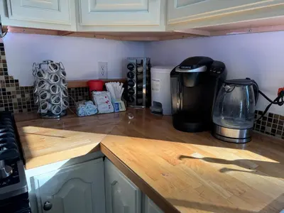 a kitchen counter top with a coffee maker on it at Enjoy Privacy - Pine Mountain - Spacious Home in Pine Mountain Club