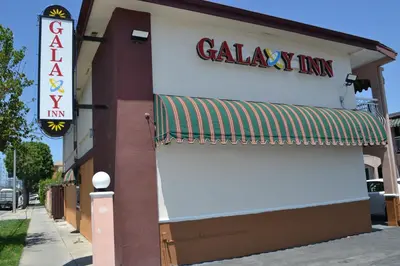 a calgary inn sign on the side of a building at Galaxy Inn in Los Angeles