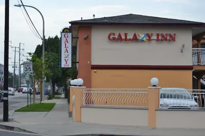 a building with a bakery sign on the side of a street at Galaxy Inn in Los Angeles
