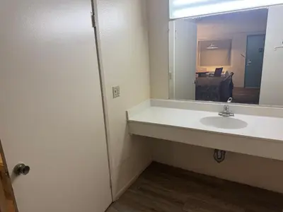 a bathroom with a sink and a mirror at Best Star Inn - Montebello, Los Angeles in Montebello