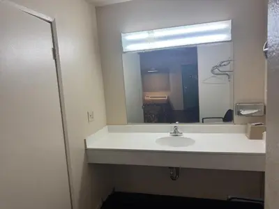 a bathroom with a sink and a mirror at Best Star Inn - Montebello, Los Angeles in Montebello