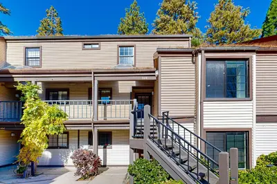an exterior view of a building with a staircase at Lake Arrowhead Views! Condo with Shared Pool and Spa in Lake Arrowhead
