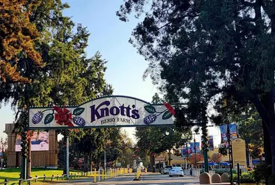 a sign for a koptis party hall on a street at Charming Bedroom Near Disney Land, Orange County in La Palma