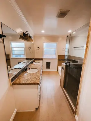 a bathroom with two sinks and a shower at Lovely home close by SOFI Stadium in Inglewood