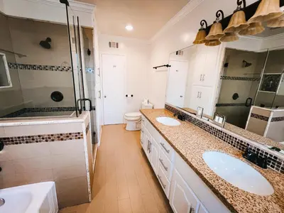 a bathroom with two sinks and a shower at Lovely home close by SOFI Stadium in Inglewood