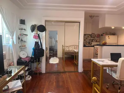 a living room with a kitchen and a dining room at Cozy Studio In West Hollywood in Los Angeles