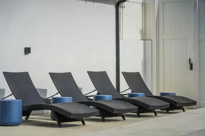 a row of black chairs sitting in a room at Los Angeles, CA Near Malibu - Pool in Los Angeles