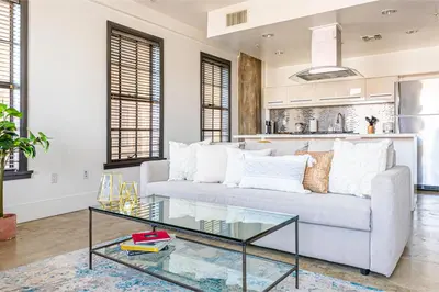a living room with a couch and a glass table at Urban 1-bedroom Apartment in Los Angeles