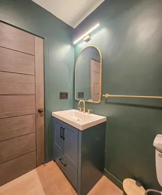 a bathroom with a sink and a mirror at Brimfield Stay in Los Angeles