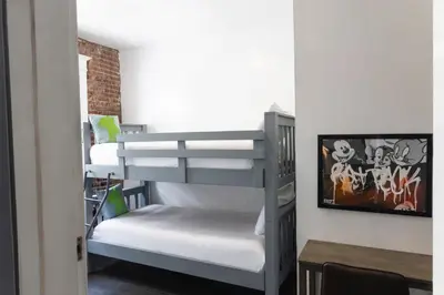 a bunk bed in a small room with a table at American Hotel in Los Angeles