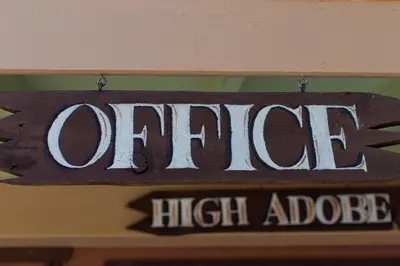 a sign that says one high addict hanging on a wall at Hilltop Tavern and Inn in Apple Valley