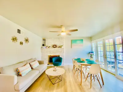 a living room with a couch and a table at Cheerful 4 bed, 2 bath with pool near Disneyland in Placentia