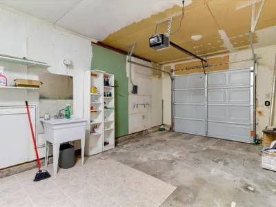 an empty garage with a sink and a door at Modern 4 bedroom in San Fernando in San Fernando