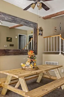 a wooden table in a room with a mirror at BIg Bear G5 Getaway in Big Bear Lake