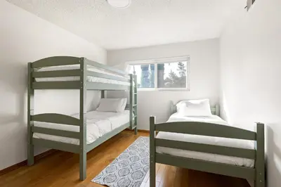 a bedroom with two bunk beds and a bed at Adorable 4 bedroom home with Pool & more in Los Angeles