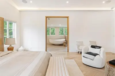 a bedroom with a large bed and a bath tub at Mediterranean Dream Villa Oasis in Los Angeles