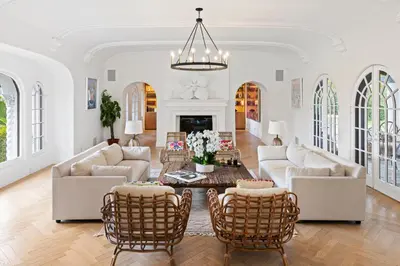 a living room with white furniture and a fireplace at Mediterranean Dream Villa Oasis in Los Angeles