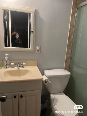 a bathroom with a toilet and a sink and a mirror at \u6e29\u99a8\u7684\u5c0f\u623f\u95f4 in West Covina