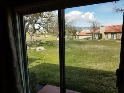 a view of a yard from a window at Beautiful Mountain Home in Tehachapi