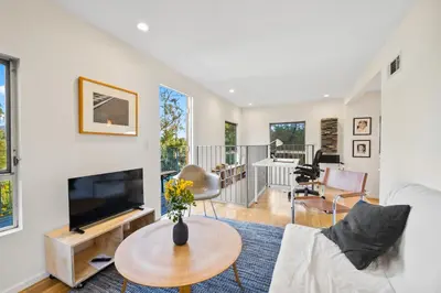 a living room with a couch and a tv at Peaceful Tranquility w Nature in Los Angeles