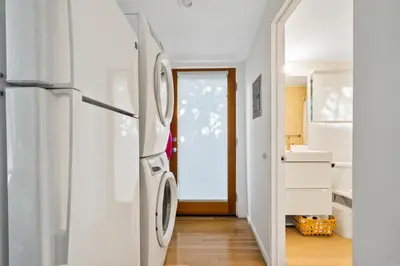 a white refrigerator in a kitchen with a door at Peaceful Tranquility w Nature in Los Angeles