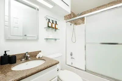 a bathroom with a sink and a shower at Oceanfront Studio with balcony in Redondo Beach