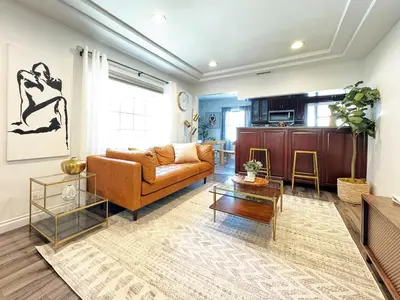 a living room with a couch and a table at Charming 2BR Spot Near LAX, SoFi and Forum - MK1-LAD in Los Angeles