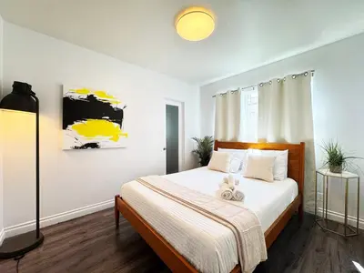 a bedroom with a bed with a teddy bear on it at Charming 2BR Spot Near LAX, SoFi and Forum - MK1-LAD in Los Angeles