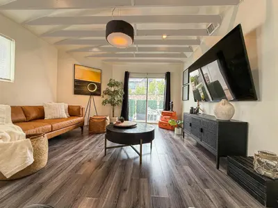 a living room with a couch and a table at Perfect 1-BR Spot Near LAX, SoFi and Forum - MK2-LAD in Los Angeles