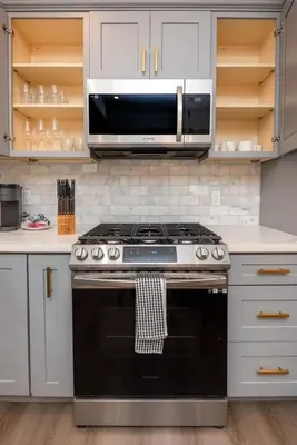 a kitchen with a stove and a microwave at Stunning 3-BR Residence with Free Parking & Patio in Los Angeles