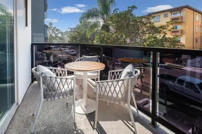 a table and chairs on a balcony with a view at Luxury 2BR Stay Balcony Views and Free Parking in Los Angeles