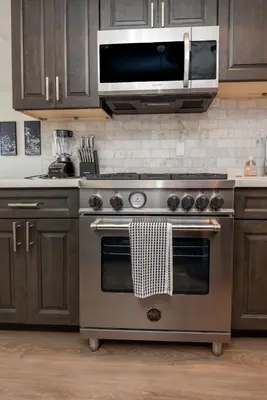 a kitchen with a stainless steel stove and a microwave at Modern and Chic 2BR Gem with Luxe Finishes, Parking in Los Angeles