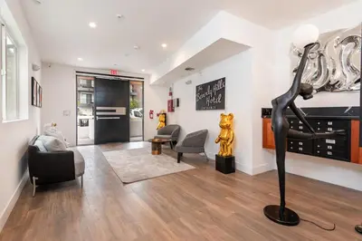 a living room with a statue of a woman at Experience Lavish LA Living Sleek 2BR with Parking in Los Angeles