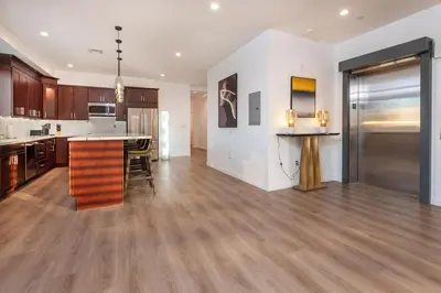 an open kitchen and living room with a counter top at Ultimate Luxurious Penthouse with Private Balcony in Los Angeles