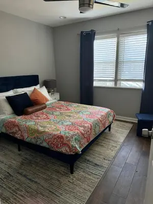 a bedroom with a bed with a colorful blanket at Hollywood escape in Los Angeles