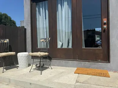 a pair of chairs sitting outside of a door at Hollywood escape in Los Angeles