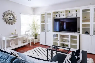 a living room with white cabinets and a tv at Luxurious Villa in Diamond Bar- Private Cul-de-Sac in Diamond Bar