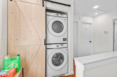 a laundry room with a washer and dryer at Game Room & In-Unit Laundry - 15 Min to Disney! in Artesia