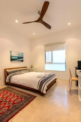 a bedroom with a bed and a ceiling fan at Luxury suite with private entrance in Los Angeles