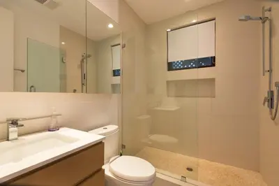 a bathroom with a toilet and a sink and a shower at Luxury suite with private entrance in Los Angeles
