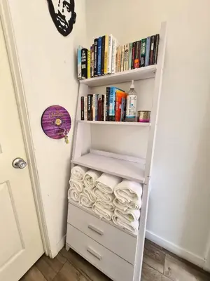 a book shelf filled with lots of books at 3 bedroom with Hot Tub and Video game console 10 minutes from Rodeo Drive Beverly Hills in Los Angeles