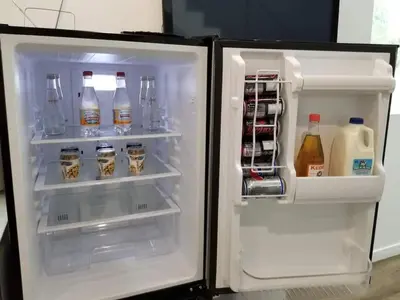 an open refrigerator filled with drinks and milk at 3 bedroom with Hot Tub and Video game console 10 minutes from Rodeo Drive Beverly Hills in Los Angeles